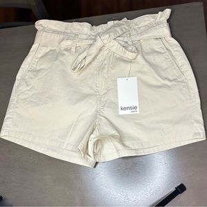 Cream shorts.